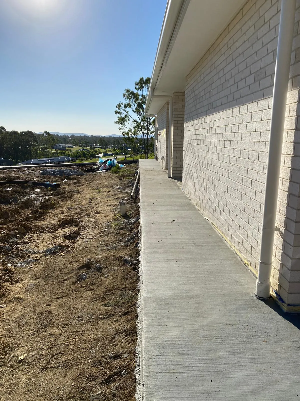 Concrete path along the side of the house